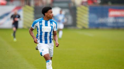 Micah Obiero in action with for his club Huddersfield Town