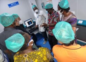 Former Prime Minister Raila Odinga (in a blue facemask) and his team visits the Ayuverdic Pharmaceutical Laboratory in India