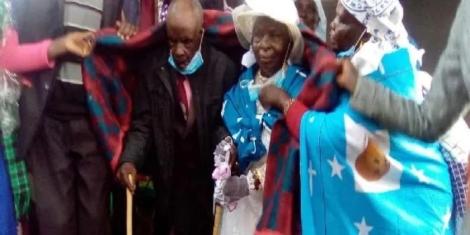 zee John Kimeli Yama and his wife Mary Chemesunde during the ceremony on Friday, October 23.jpg