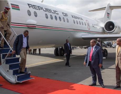 President Uhuru Kenyatta alighting from a plane.