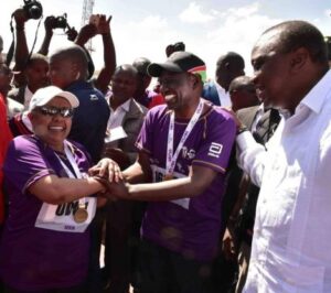 First Lady Margaret Kenyatta (left) is congratulated by Deputy President William Ruto (centre) after completing her 10km race as President Kenyatta looks on at the Beyond Zero Marathon in 2019.