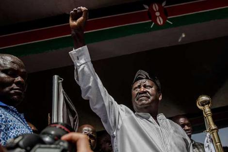 Opposition leader Raila Odinga gestures before his swearing in as the people's president on January 30, 2018 at Uhuru Park Nairobi.