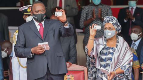 Undated Photo of President Uhuru Kenyatta and First lady Holding Huduma Namba