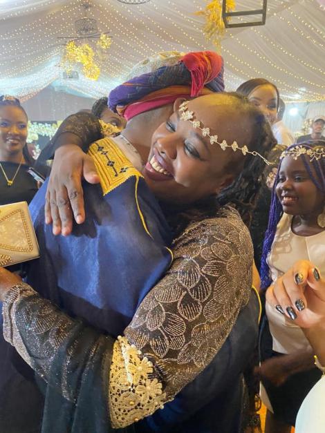 Citizen TV's Faizah Wanjiru embraces her colleague, Rashid Abdalla, during his birthday celebrations on May 8, 2022.