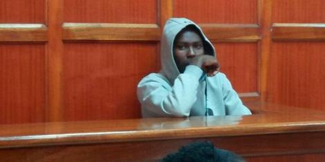 Sim-swap fraud suspect, Gideon Mark who is accused of stealing Ksh597,100 from a police OCPD in court on Monday, May 23, 2022.