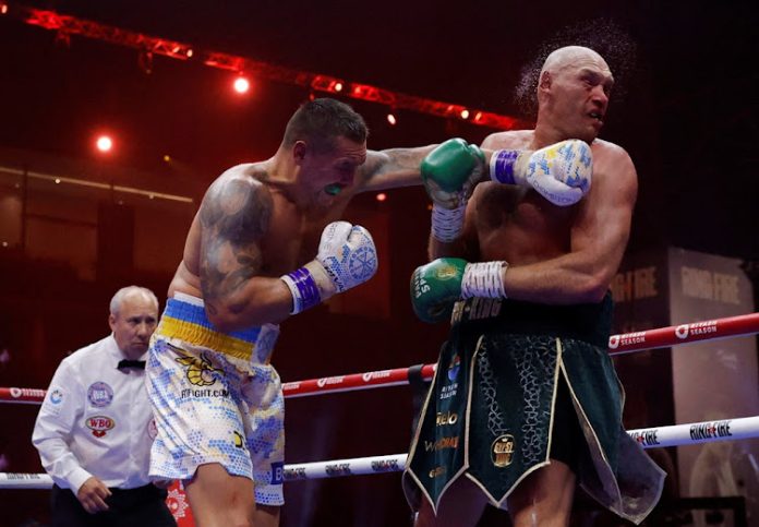 Oleksandr Usyk lands a left on Tyson Fury during their heavyweight bout in Riyadh, Saudi Arabia