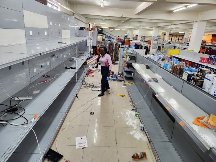 Tens of youths invaded Naivas Supermarket on Tuesday evening looting goods worth millions of shillings before torching the office of area MP Jane Kihara