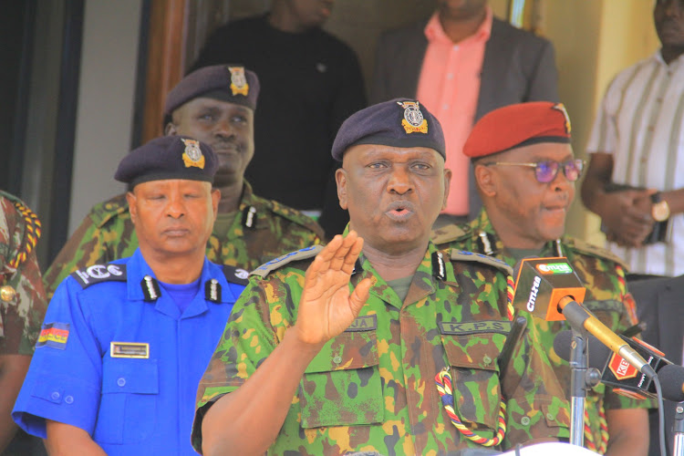 Acting Inspector General Douglas Kanja addresses the media outside Jogoo House on July 14, 2024.