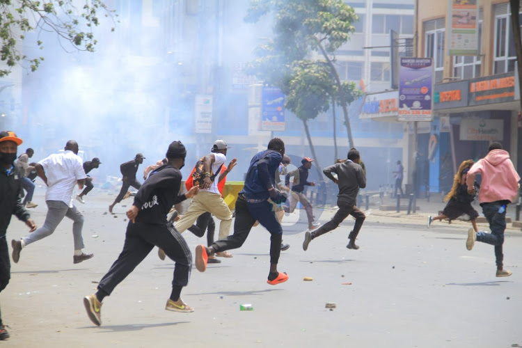 Police disperse protesters on Nairobi's Moi Avenue on Tuesday, July 2, 2024.