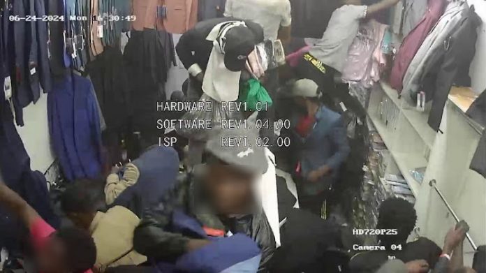 CCTV footage showing suspects looting at a boutique.