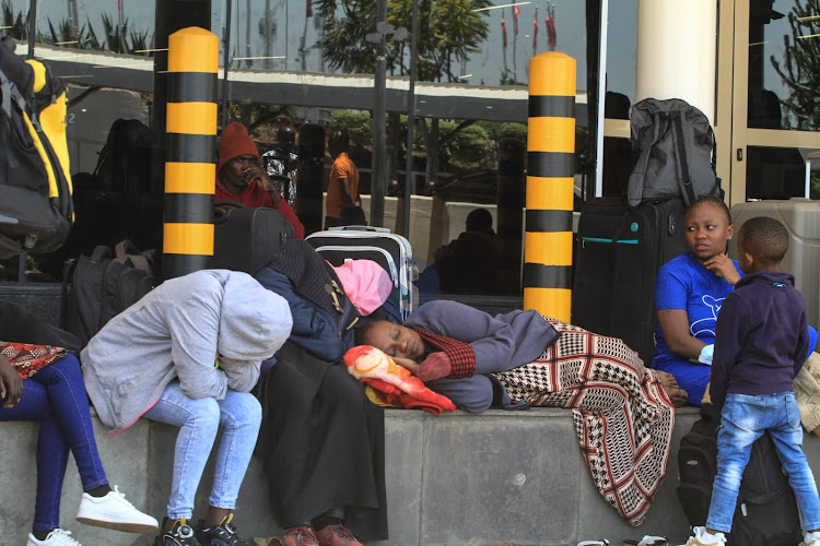 Stranded passengers sleep outside JKIA terminals following strike by airport workers over the Adani take over deal on September 11, 2024.